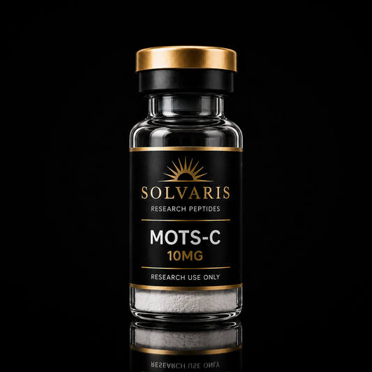 A glass vial of Solvaris MOTS-C 10MG research peptides, featuring a black label with gold lettering and a metallic gold cap, set against a solid black background with a reflection below.